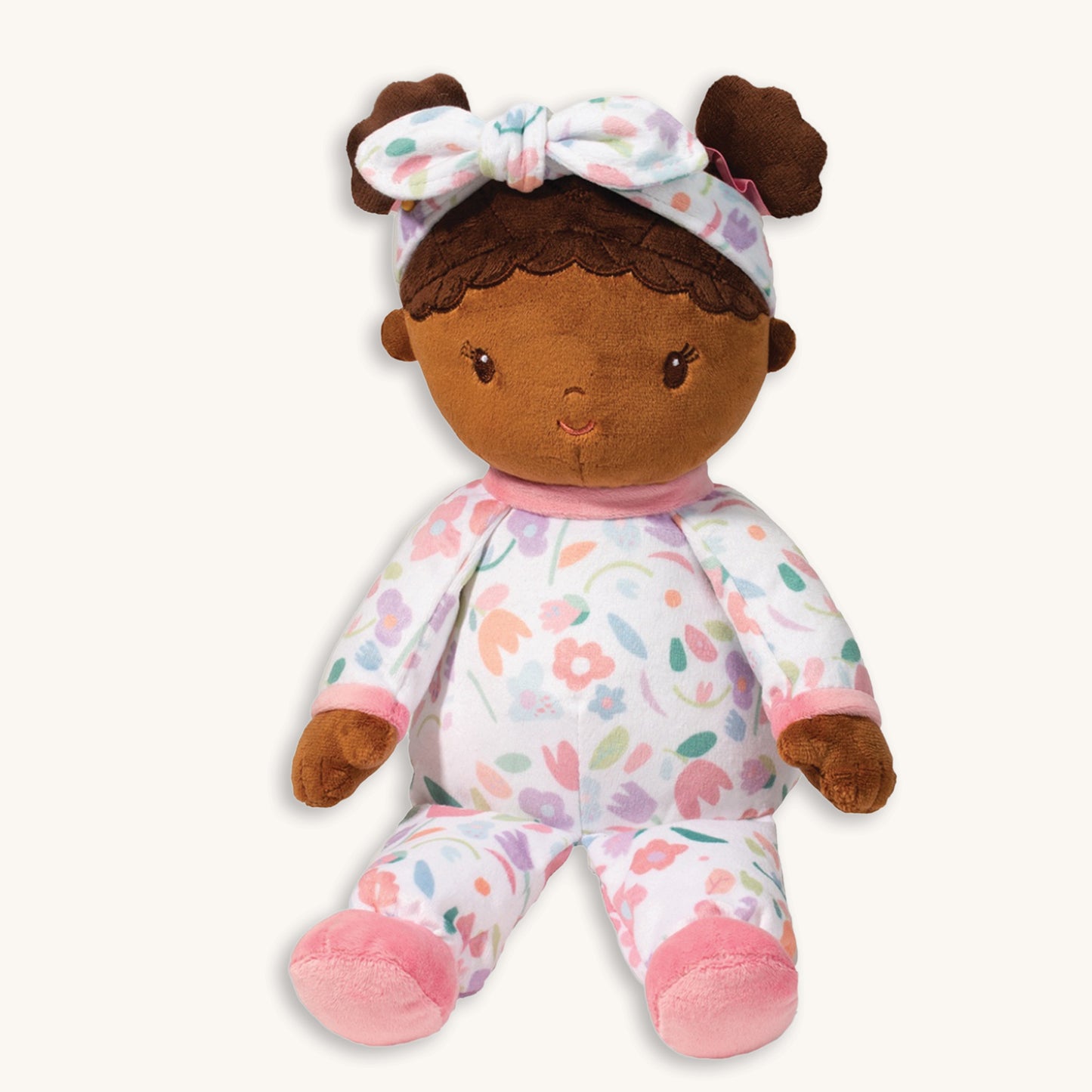 Lola blossom plush doll 13 inch overall with embroidered face, wearing pastel floral pajamas with pink trim and matching headband, machine washable, birth+