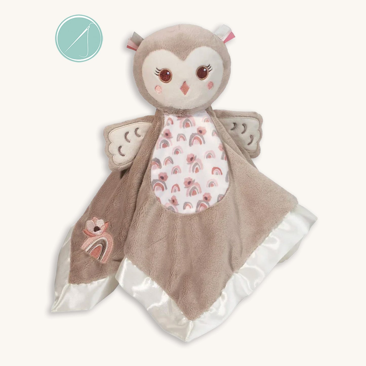 Nova owl snuggler lovey in tan plush with satin trim, rainbow and poppy details on belly and embroidered rainbow corner accent, baby-safe embroidered face